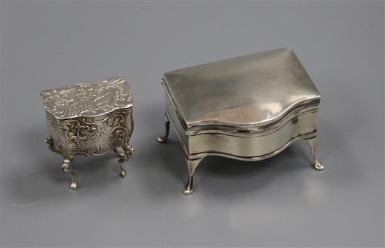 A George V silver serpentine trinket box and a late Victorian miniature bombe shaped pill box modelled as a chest.